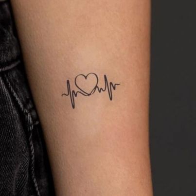 Tiny tattoo by Meena