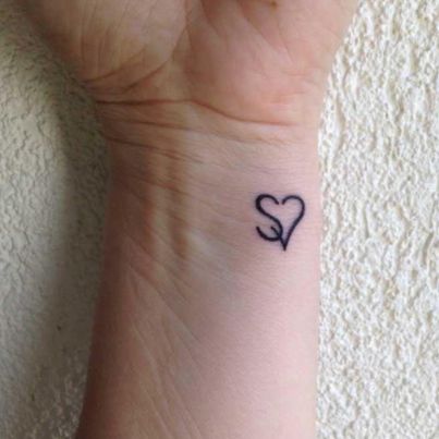 Tiny tattoo by Meena