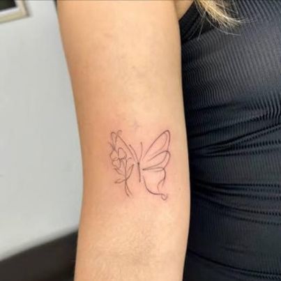 Tiny tattoo by Meena